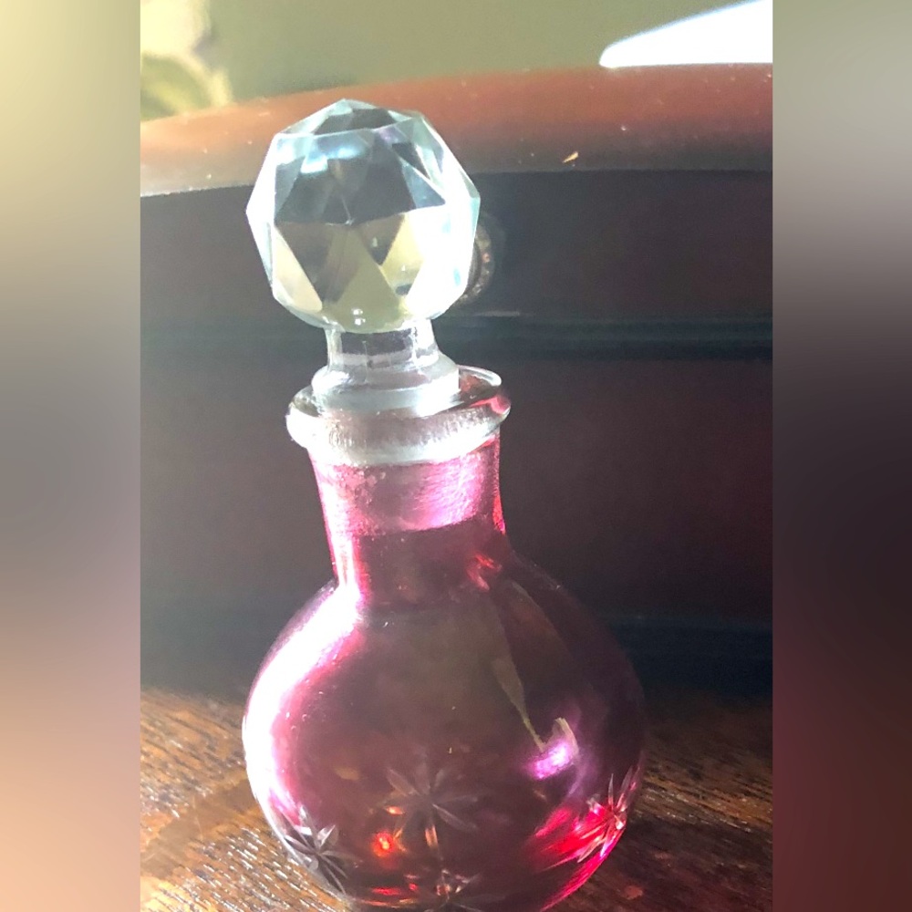 Antique Perfume Bottle made with Cranberry glass with carve florets and beveled